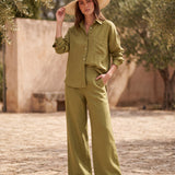 Van Palma Lune wide-leg linen trousers in olive green, worn by a model