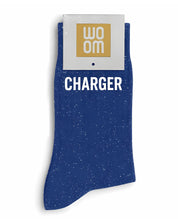 Vibrant blue glitter message socks with a white jacquard CHARGER inscription at the ankle, presented in their original Woom paper packaging.