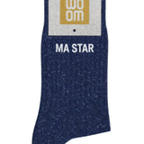Deep navy glitter message socks with a white jacquard MA STAR inscription at the ankle, presented in their original Woom paper packaging.