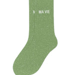 Side profile view of the almond green glitter sock showing the comfortable elasticated ankle and the clean white MA VIE wording detail.