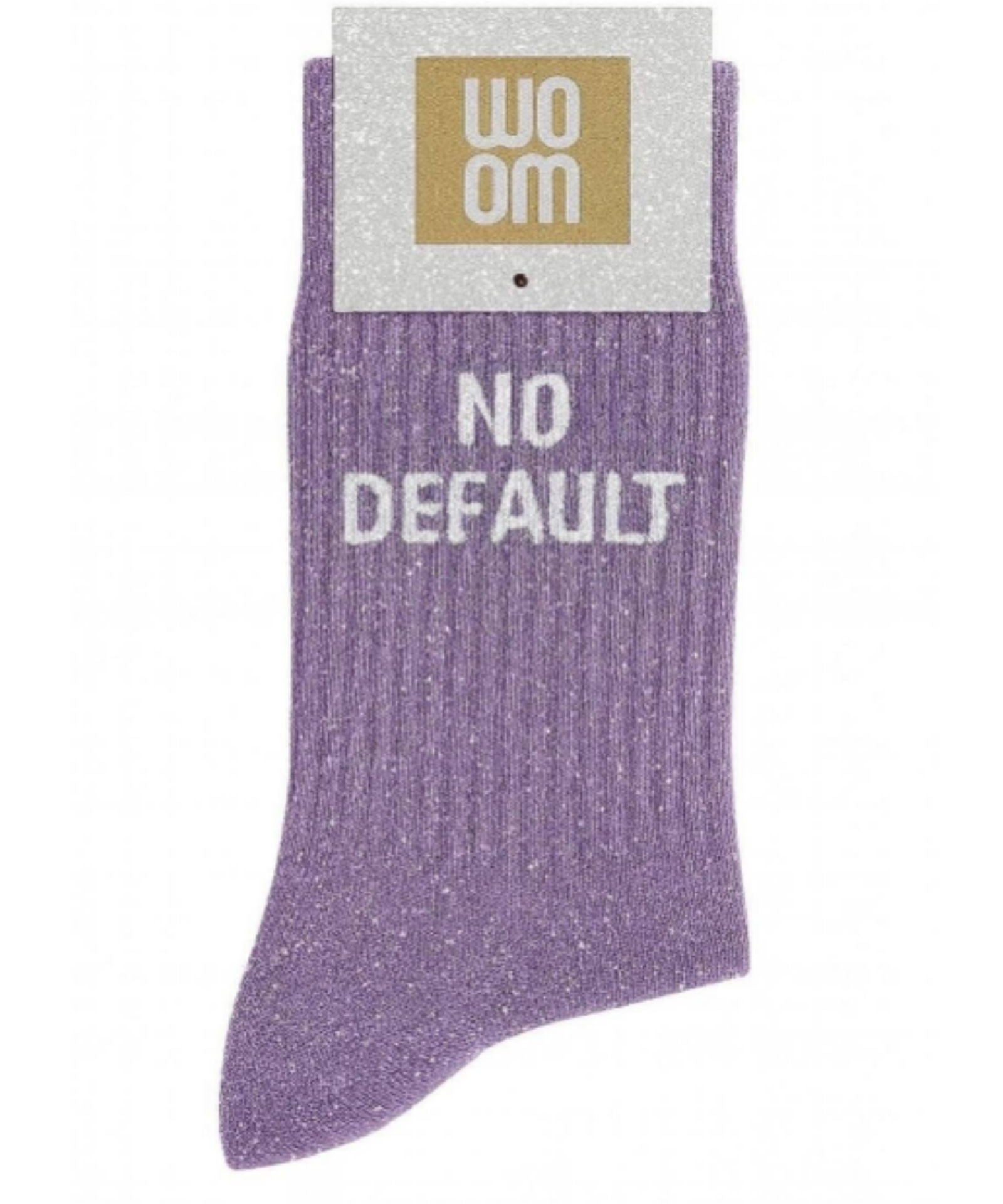 Mauve glitter message socks with a white jacquard NO DEFAULT inscription at the ankle, presented in their original Woom paper packaging.