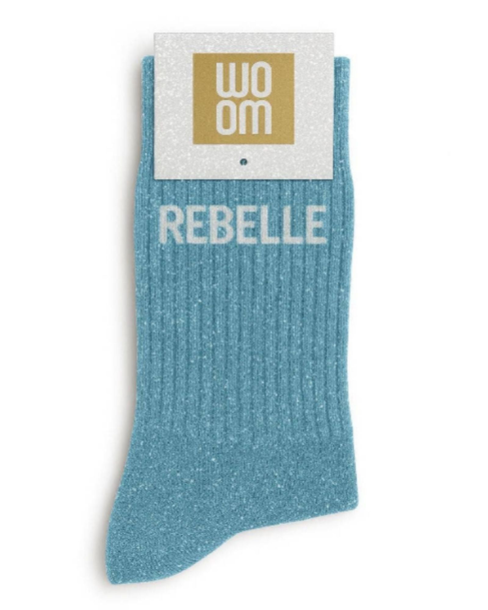 Vibrant turquoise glitter message socks with a white jacquard REBELLE inscription at the ankle, presented in their original Woom paper packaging.