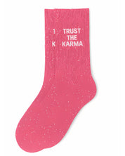 Side profile view of the pink glitter sock showing the comfortable elasticated ankle and the bold white TRUST THE KARMA wording detail.
