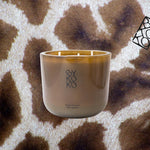 Bykoko After Ski luxury decorative 1kg scneted candle with fresh pine amber, vanilla, and leather notes. Hand-poured in a premium glass vessel, made in Switzerland.