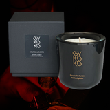 Bykoko Havana Lovers scented candle in an elegant black glass vessel, featuring notes of Bergamot, Sandalwood, and Tonka Bean. Handmade in Geneva.