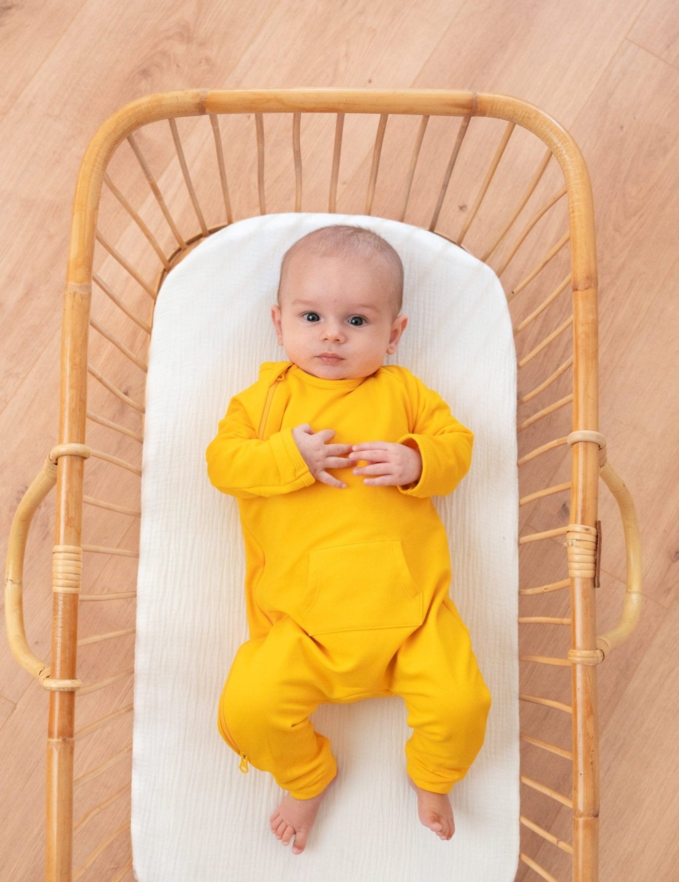 baby in Tilouco's Mustard Yellow Baby Grow