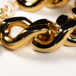 Close-up of the gold flat chain bracelet by Vanessa Baroni featuring oversized acetate links