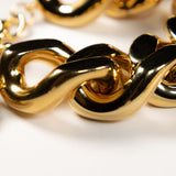 Close-up of the gold flat chain bracelet by Vanessa Baroni featuring oversized acetate links