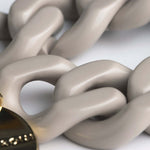 Close-up of Vanessa Baroni’s Glossy Grey Flat Chain Bracelet, featuring oversized acetate links.
